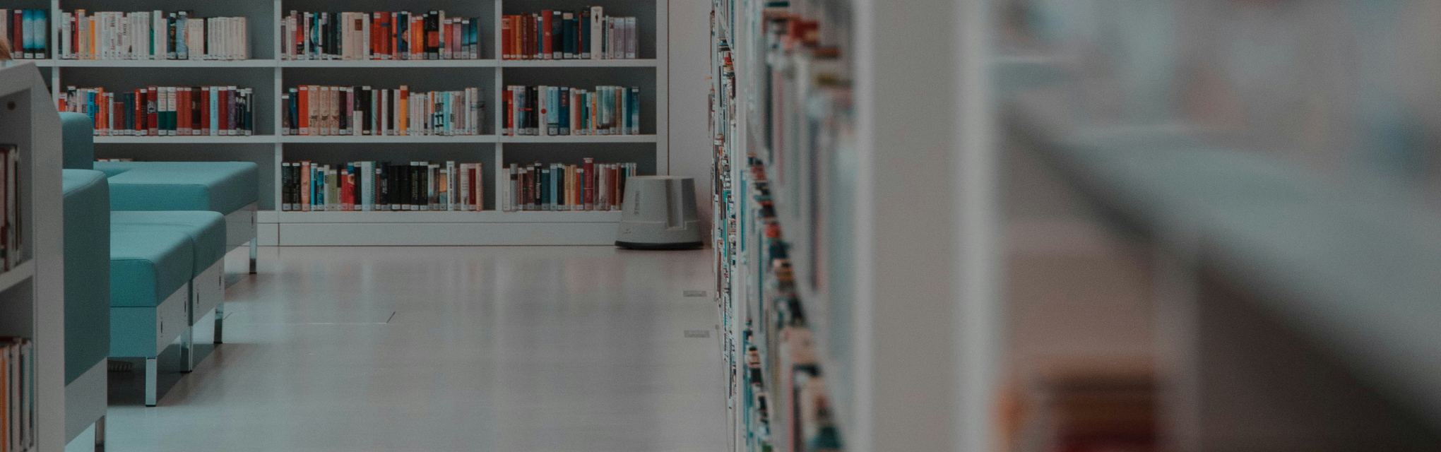A bright modern library with colourful bookshelves